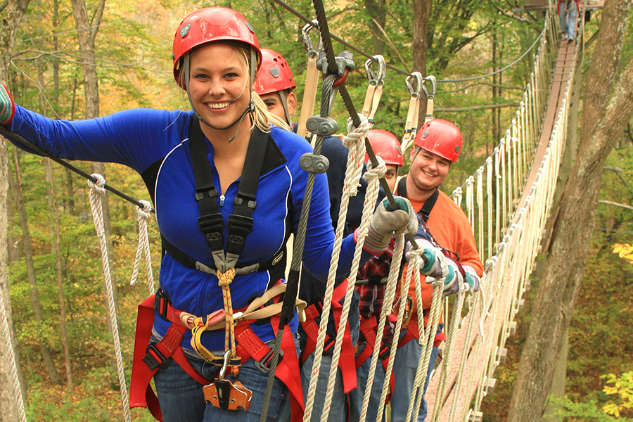 Guests at Canopy Tours on swinging bridge