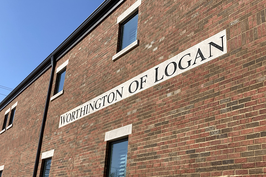 Worthington of Logan sign on building brick wall